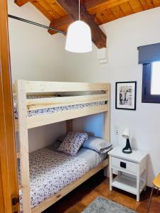 a bunk bed in a room with a lamp at CASA DE LA BODEGA in Espluga de Francolí