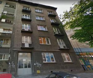 a tall building with windows and balconies on a street at Studio near Old Town in Krakow