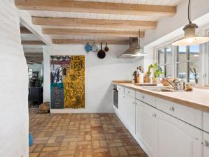 A cozinha ou kitchenette de Holiday Home Anneka - 4km from the sea in NW Jutland by Interhome