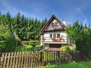 a house with a fence in front of it at Holiday Home Hůrka by Interhome in Horní Planá
