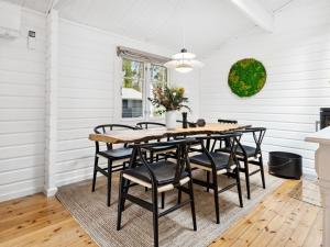 a dining room with a table and chairs at Holiday Home Eddi - 10km from the sea in Djursland and Mols by Interhome in Rønde