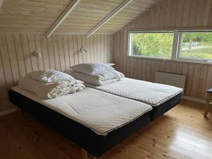 Un pat sau paturi într-o cameră la Holiday Home Esther - 500m from the sea in SE Jutland by Interhome