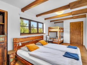 Postel nebo postele na pokoji v ubytování Holiday Home Pod Liščím Kopcem 6-4 by Interhome