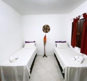 Cama ou camas em um quarto em Eco Pousada Mentawai