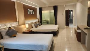 Katil atau katil-katil dalam bilik di iRest Ao Nang