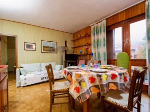 a living room with a table and a bed at Apartment Le MOTTE by Interhome in Abetone