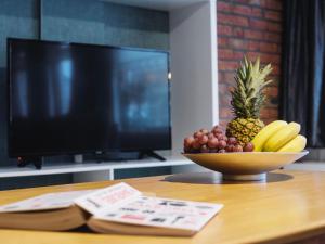 TV a/nebo společenská místnost v ubytování Apartment Delfzijl by Interhome