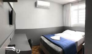 Postel nebo postele na pokoji v ubytování Nap Hotel
