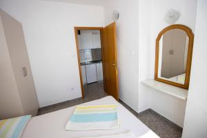 Postel nebo postele na pokoji v ubytování Apartmani Vesna