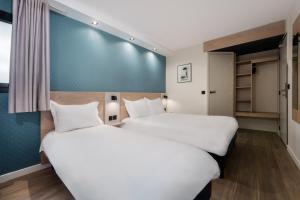Postel nebo postele na pokoji v ubytování KYRIAD DIRECT ORLEANS NORD - Cap Saran + 37 fotografií