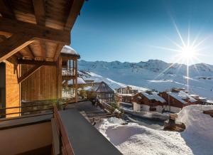 a winter view from the balcony of a chalet at Chalet Carte Blanche Orlov in Val Thorens
