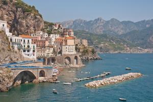 a view of a town with a bridge and boats in the water at Ospitalità Il NOCE in Brusciano