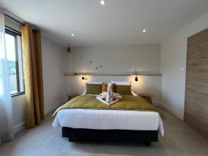 Postel nebo postele na pokoji v ubytování Le Petit Hôtel de Pianottoli-Caldarello