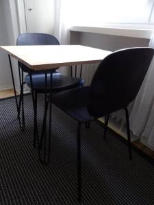 a table and two chairs sitting next to a window at Studio in the center area with free street parking in Vaasa