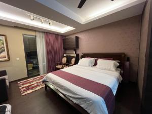 Postel nebo postele na pokoji v ubytování Guest Studio/Suite Condominum Near Batu Caves