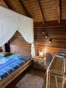 Postel nebo postele na pokoji v ubytování Le Neem