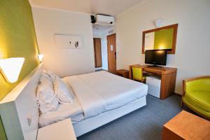Кровать или кровати в номере Hotel Varandas do Atlântico by RIDAN Hotels