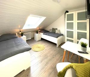 a bedroom with a bed and a skylight at Monteurwohnung in Bochum in Bochum