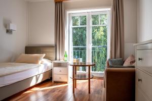 Postel nebo postele na pokoji v ubytování Hotel Gregory Wyk auf Föhr