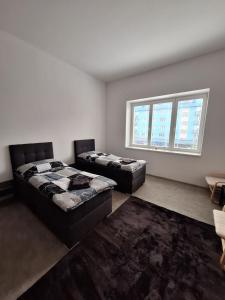 Letto o letti in una camera di Apartmány Přerov 22
