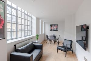 a living room with a couch and chairs at Dolls House - Farringdon - by Frankie Says in London