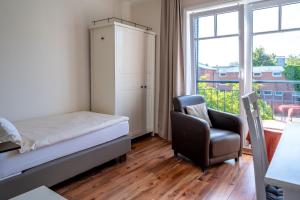 Postel nebo postele na pokoji v ubytování Hotel Gregory Wyk auf Föhr