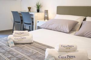 Posteľ alebo postele v izbe v ubytovaní B&B Cala Peppa