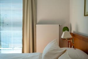 Postel nebo postele na pokoji v ubytování Hotel Gregory Wyk auf Föhr