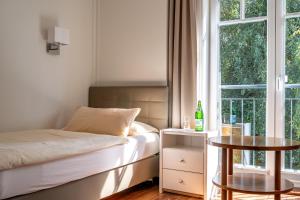 Postel nebo postele na pokoji v ubytování Hotel Gregory Wyk auf Föhr