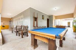 Billede fra billedgalleriet på Piscina 6 QUARTO 300m PRAIA jardim churrasqueira 16 PESSOAS garagem 3 carros Monitoramento 24 horas Mesa de sinuca i Itanhaém