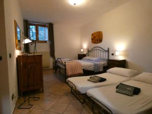 Postel nebo postele na pokoji v ubytování SCAPPO IN UMBRIA, La Casa nel bosco