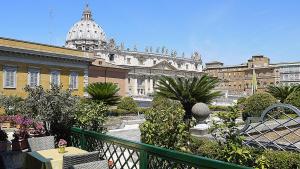 a balcony with a view of a building with a dome at Residenza Paolo VI in Rome