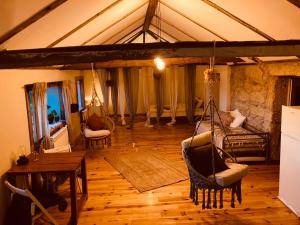 a living room with chairs and a table at The Loft With a View in Cabeceiras de Basto