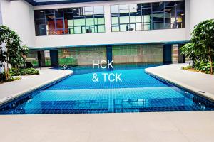 a swimming pool in front of a building at Next2Mall at Sunway Velocity Two by HCK in Kuala Lumpur