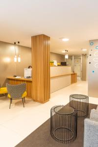 an office lobby with chairs and a reception desk at RK Farallón Canteras in Las Palmas de Gran Canaria