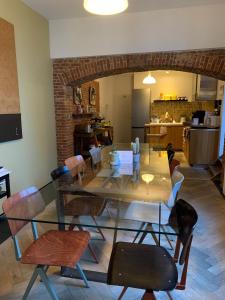 a dining room with a long table and chairs at B&B DRUUM in Brussels