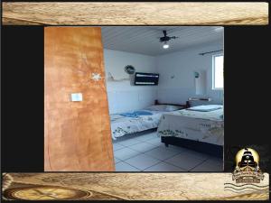 Postel nebo postele na pokoji v ubytování Pousada Piratas Di San Rocco