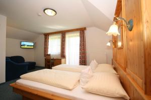 Postel nebo postele na pokoji v ubytování Hotel Cafe' Hermann