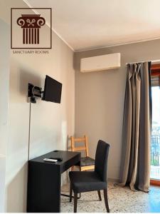 TV i/ili multimedijalni sistem u objektu Sanctuary Rooms