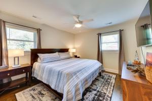 a bedroom with a bed and a ceiling fan at 4 Mi to Beach Wilmington Home with Gazebo Deck! in Wilmington