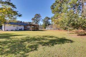 a house in a field with a large yard at Wilmington Home with Gazebo Deck 4 Mi to Beach! in Wilmington