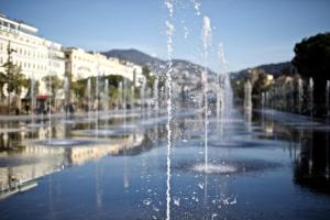 a water fountain in the middle of a city at "Le Zen" by EnjoyNice, central spacious apartment with Airco, beach at 10 min in Nice