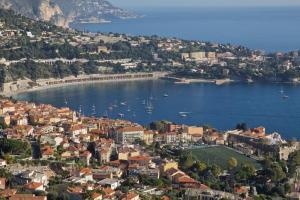 an aerial view of a town with boats in the water at "Le Zen" in Nice
