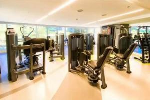 a gym with several tread machines in a room at Hotel Nacional Apart Lux in Rio de Janeiro