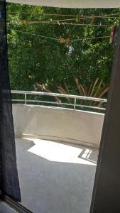 a window view of a patio with a fence at Habitaciónes El Mirador in Cartagena de Indias