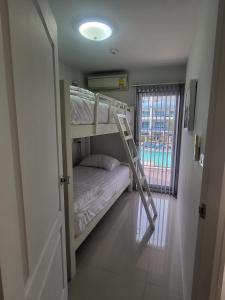Postel nebo postele na pokoji v ubytování Grand Beach Condo A207 + 7 fotografií
