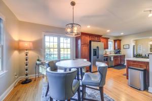 a kitchen with a round table and chairs at Idyllic and Central New Bern Home with Screened Porch! in New Bern