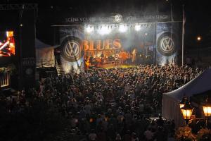 a large crowd of people standing in front of a stage at Tremblant Les Eaux A - Mont-Tremblant in Mont-Tremblant +37 photos