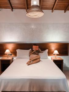 Cama ou camas em um quarto em Hiu Hotel