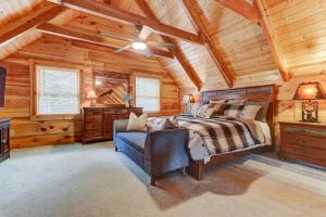 a bedroom with a bed in a wooden cabin at LUX 4BD Lodge w/ Views! Fire Pits + HOT TUB + Pool in Gatlinburg +38 photos